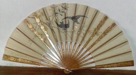 Pericon hand fan with wooden sticks and golden decoration