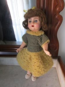 Cardboard doll with glass eyes